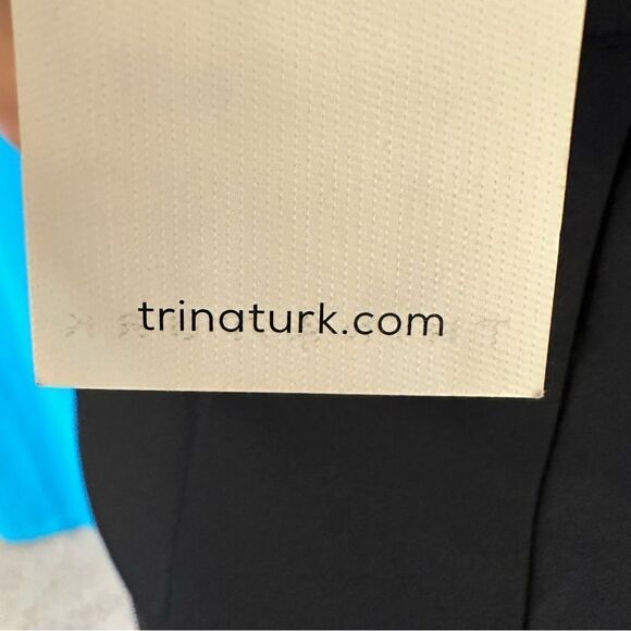 C17- Trina Turk black dress with elegant details to accentuate fit . - Picture 4 of 6